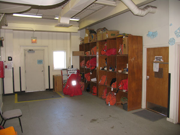 Inside Building 140 and the handy shelves for putting bags in